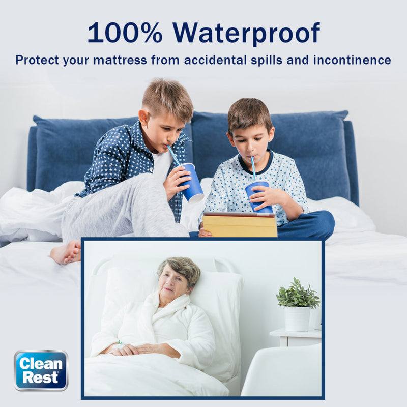 Two boys drinking out of cups with straws while sitting on a mattress.
